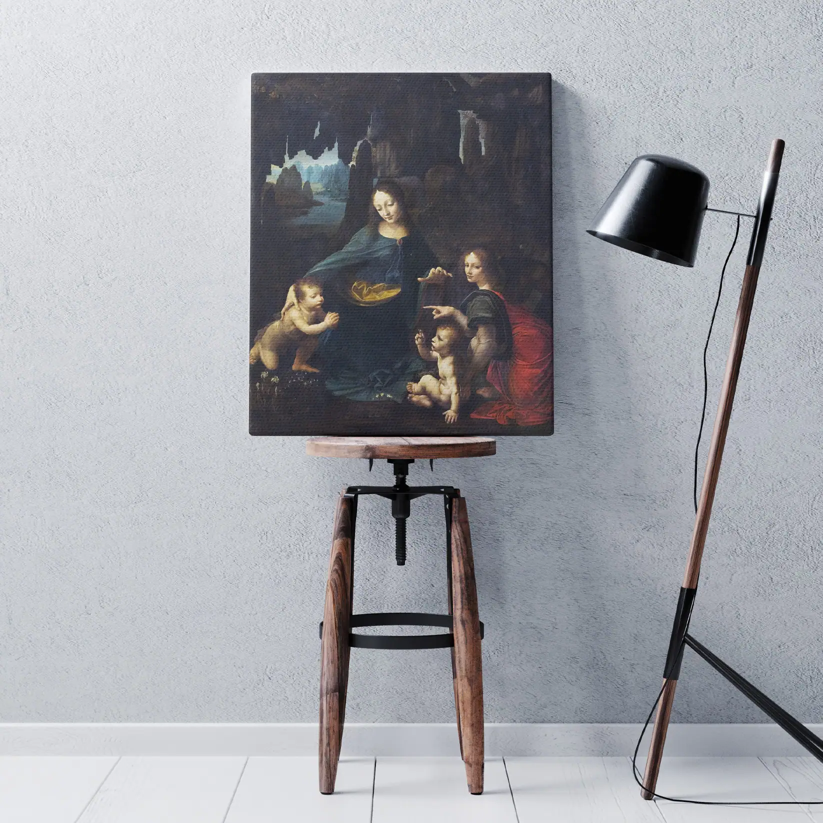 Quadro Vergine delle Rocce Leonardo da Vinci su sgabello in ambiente moderno.